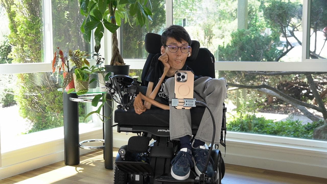 Portrait of Vahid Rajabloo, developer and founder, seated in his power wheelchair.